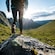 A hiker crosses a large boulder through Serra Devassa on São Miguel Island